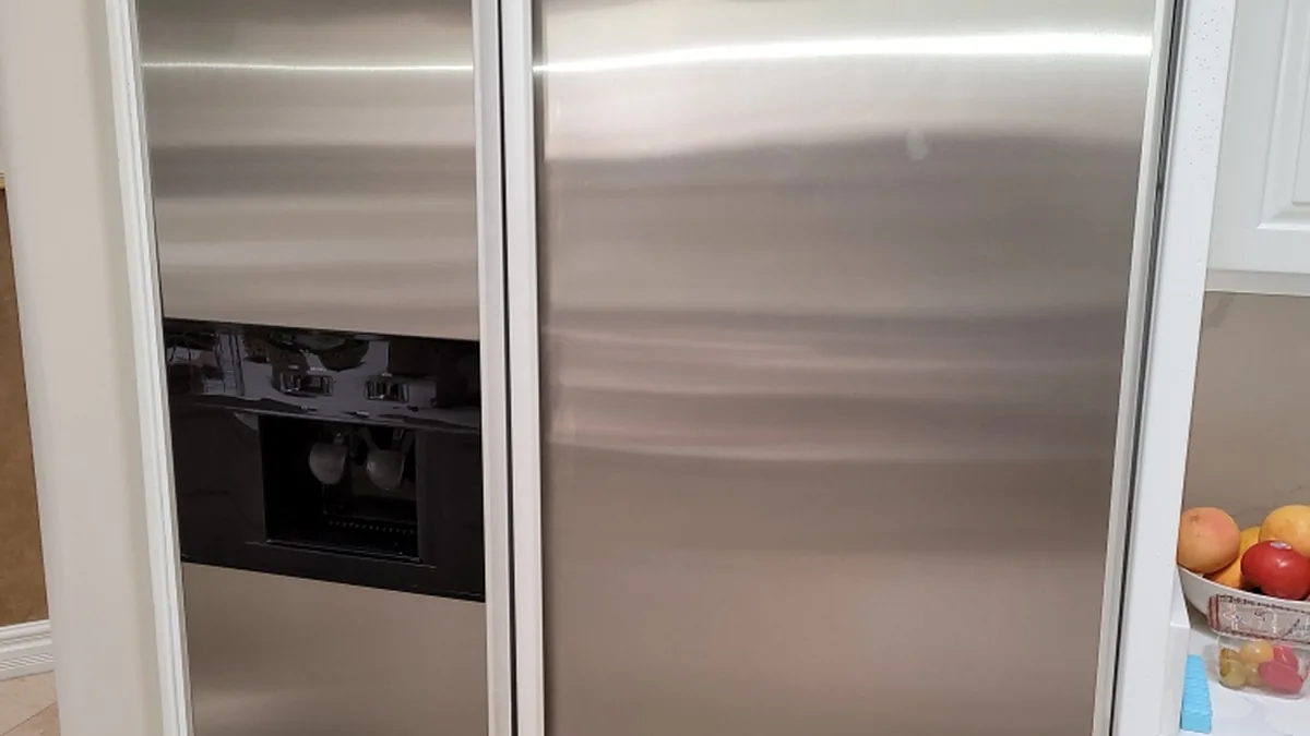 Factory-certified appliance repair technician servicing luxury refrigeration, laundry suites, and cooking ranges in Portola Valley, CA